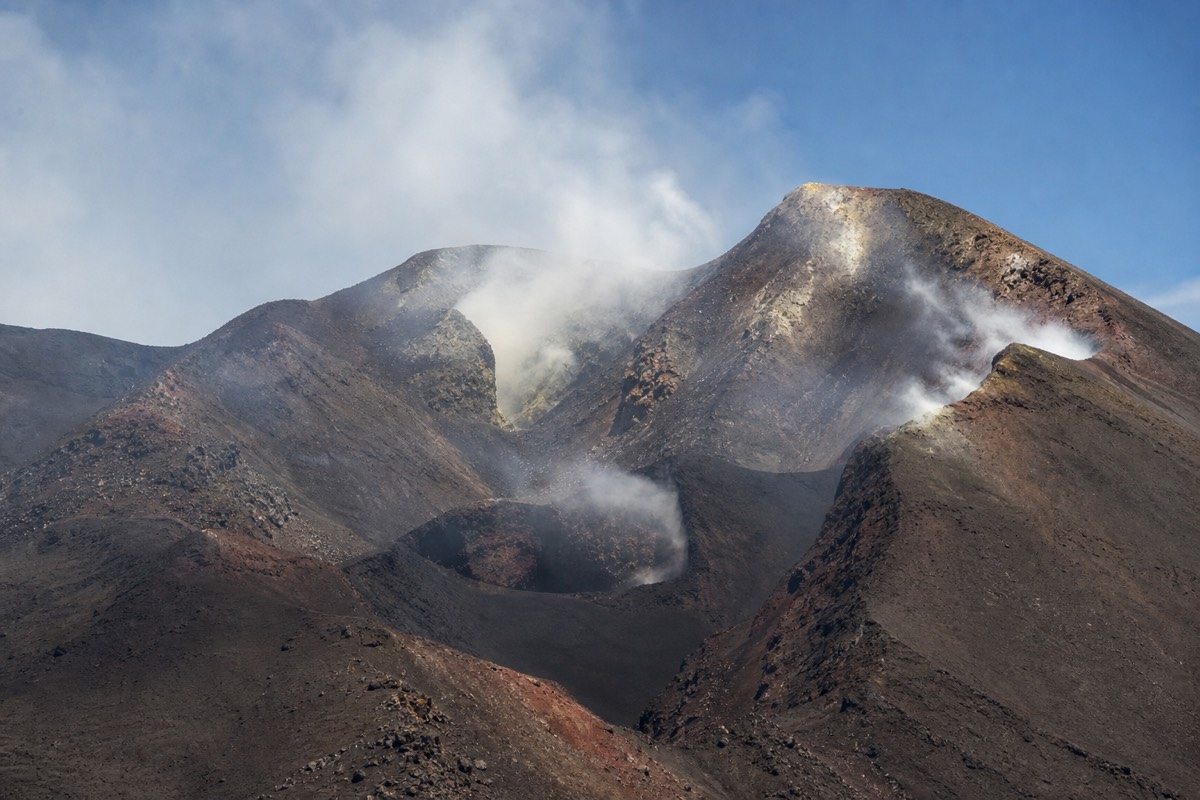 Steam and gas rising from Mount Etna's summit craters, a sign of everyday volcanic activity on Mount Etna