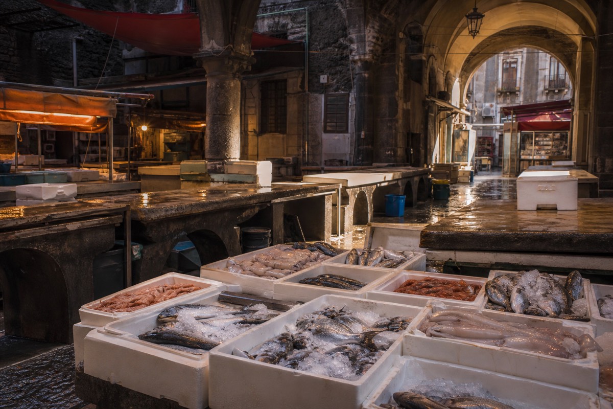 A bustling fish market in the gateway city for an Etna day trip from Catania